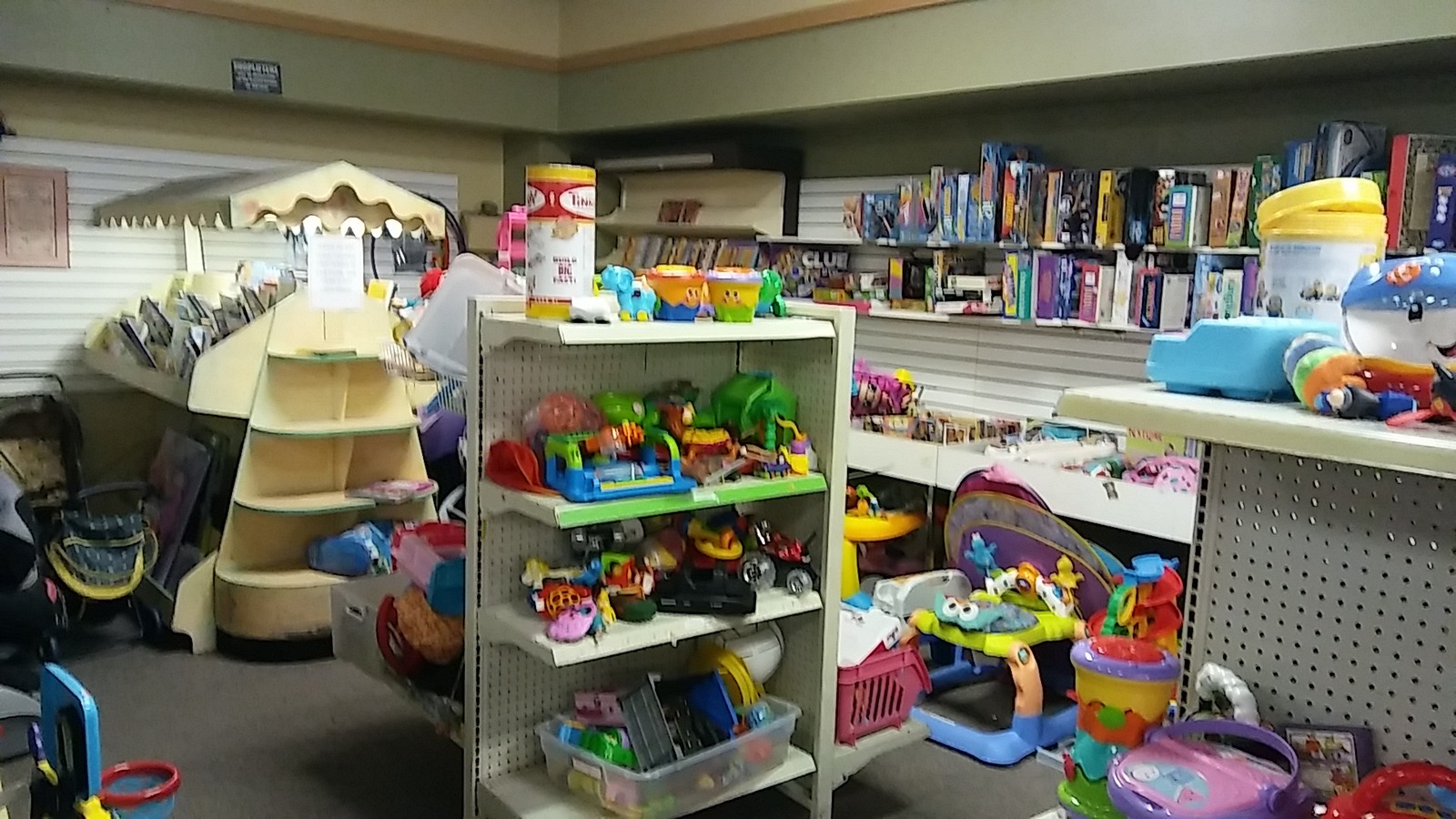 Toy shelves beside a broad secondhand book department