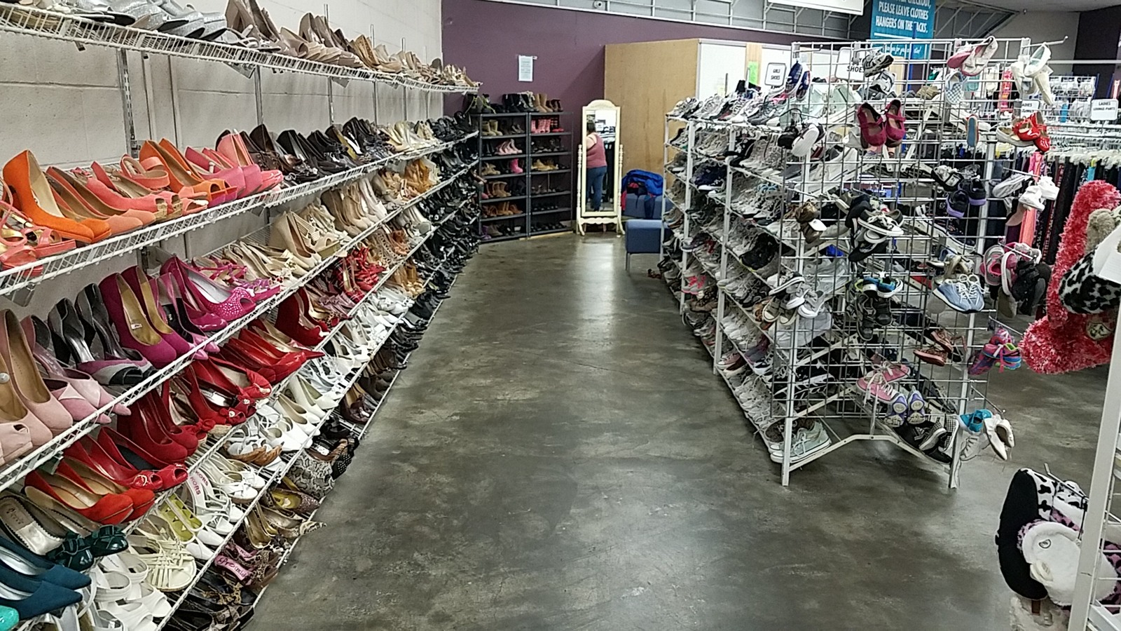 Long aisle of shoes and accessories in the Rialto store