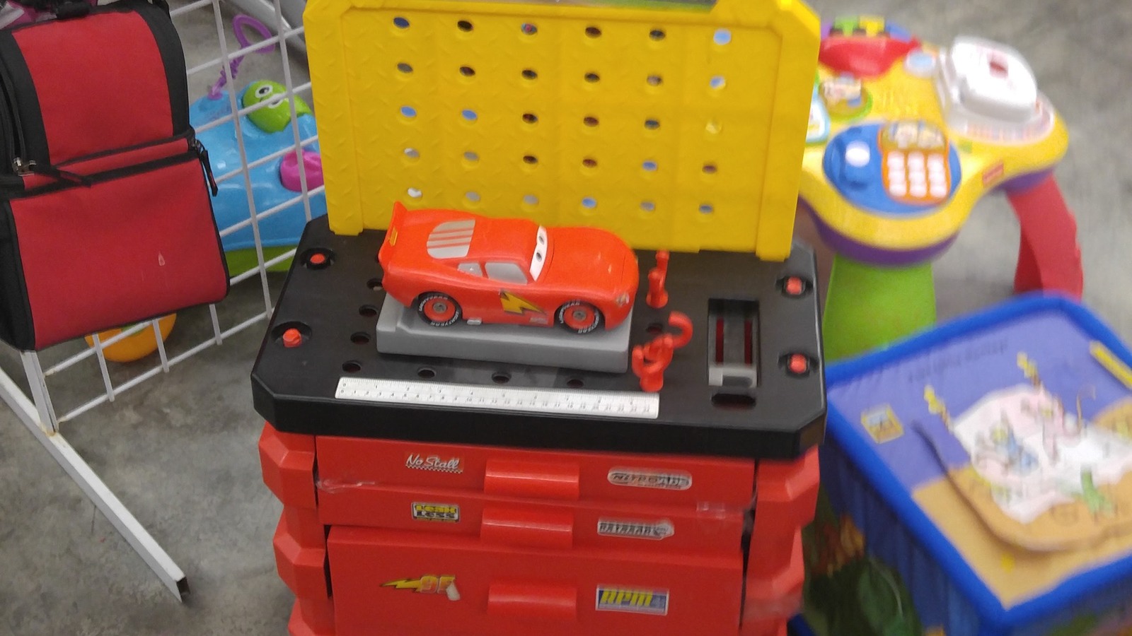 Colorful children’s ride-on toys and lunch bags