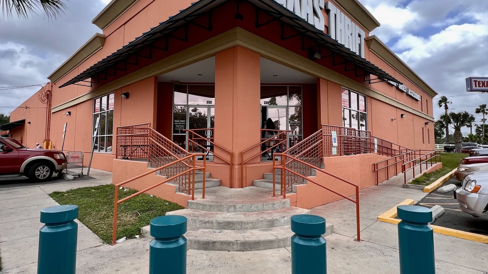 Peach-colored Texas Thrift storefront with an accessible entrance in McAllen