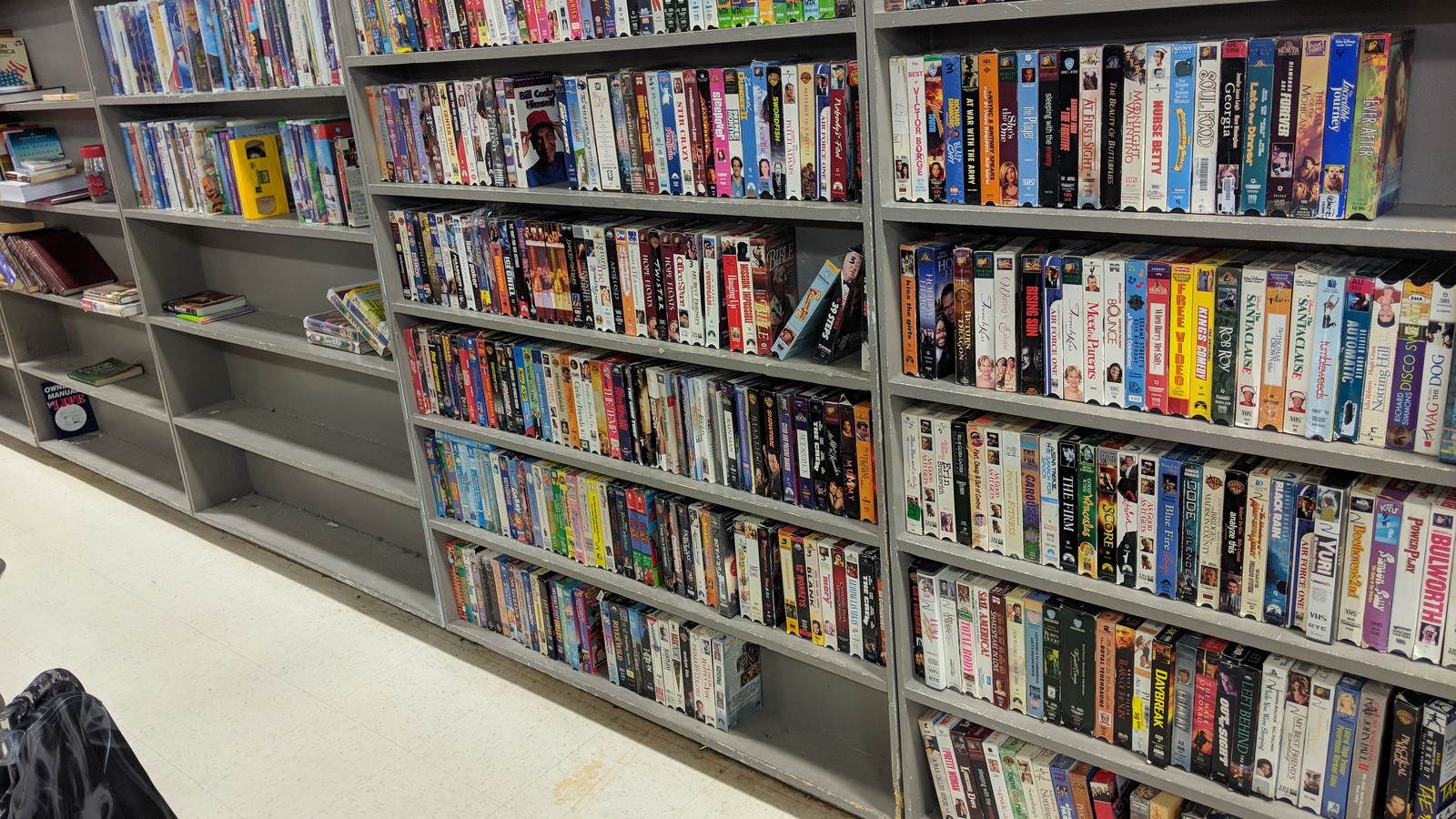 Rows of books and movies in the media department at Texas Thrift