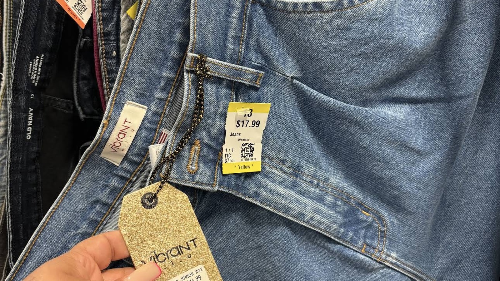 Blue denim with stitched details and color tags at Texas Thrift