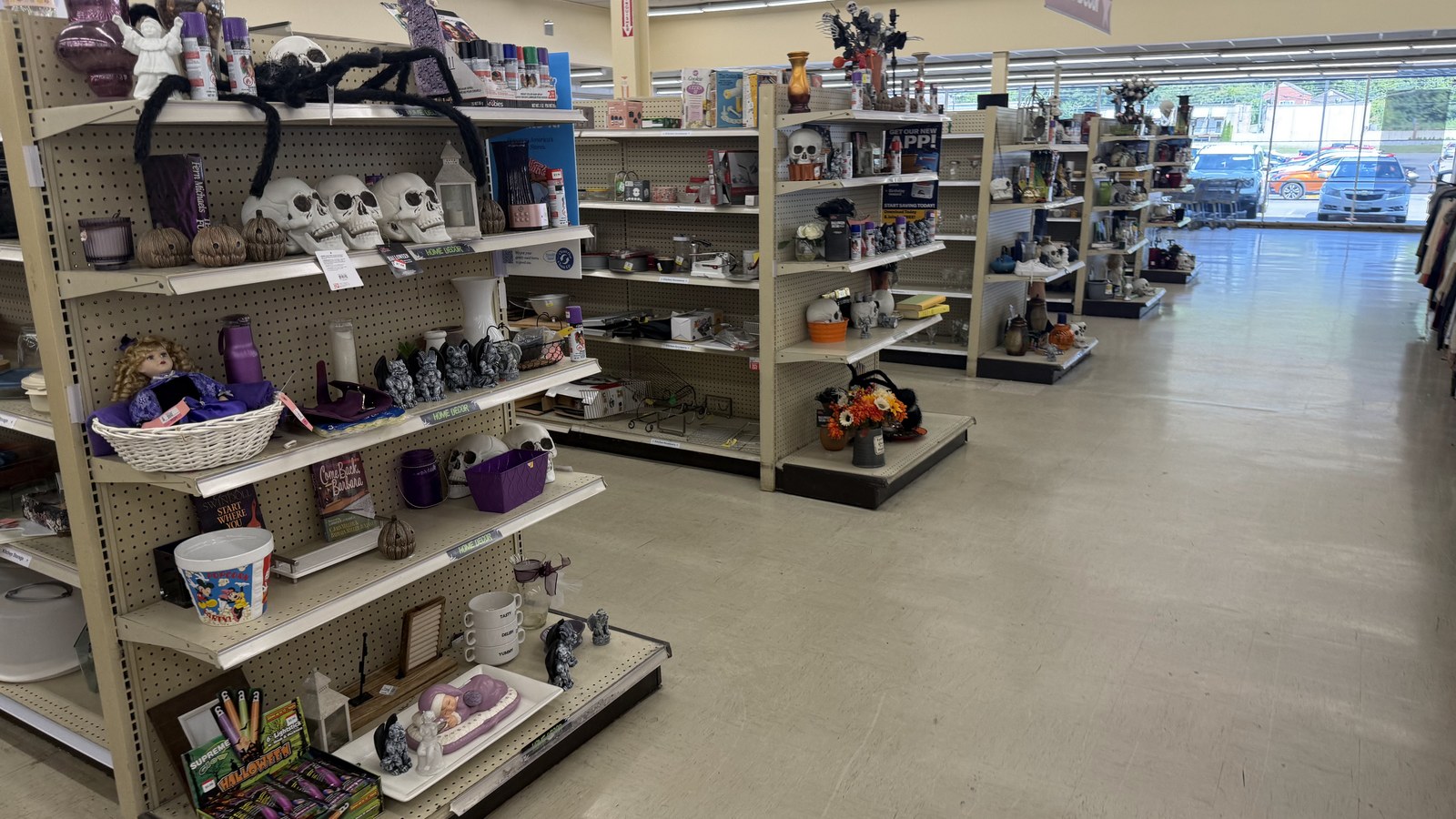 Housewares, baskets, and seasonal decor arranged on open shelves