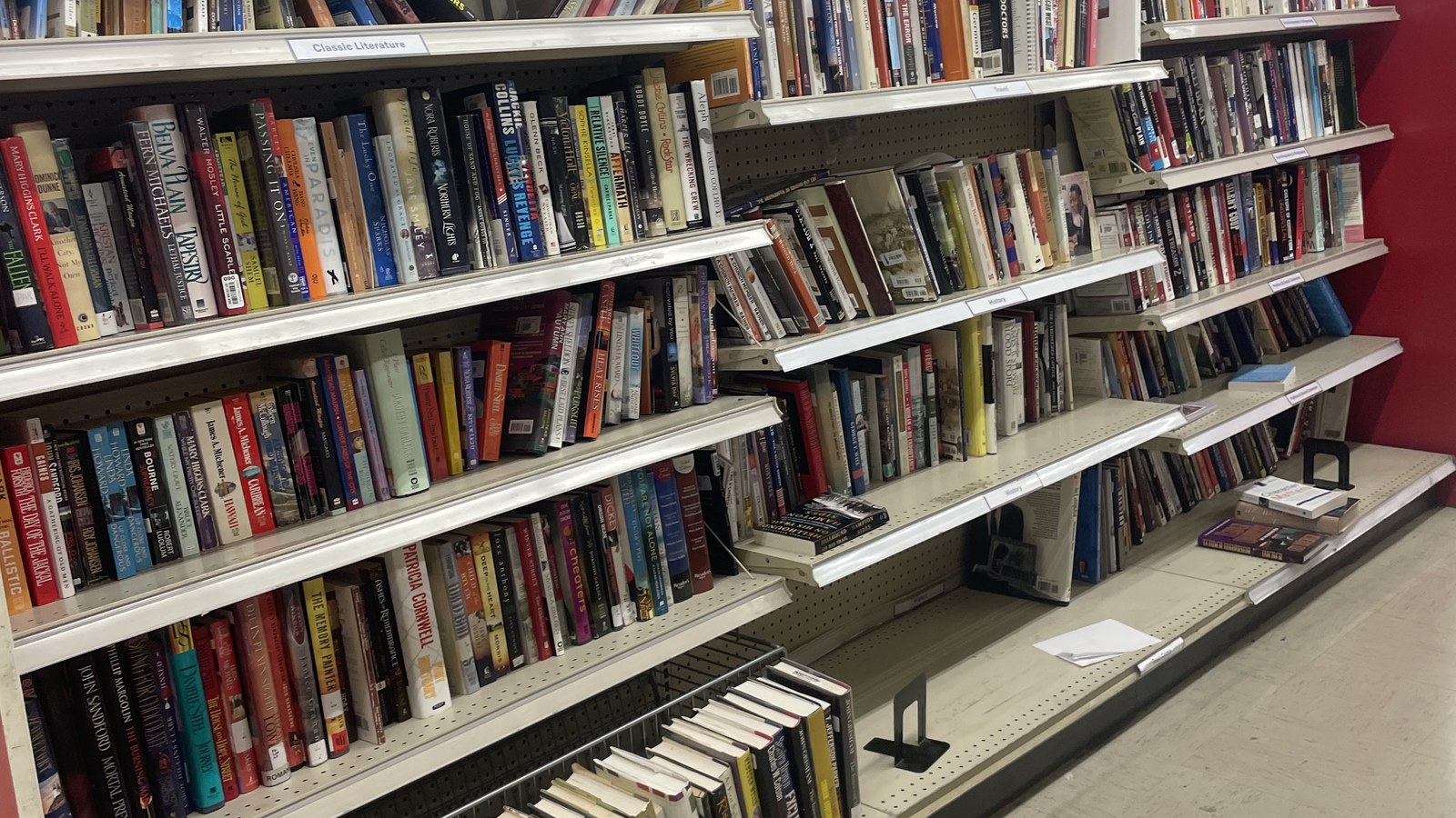 Shelves filled with secondhand books and piano music