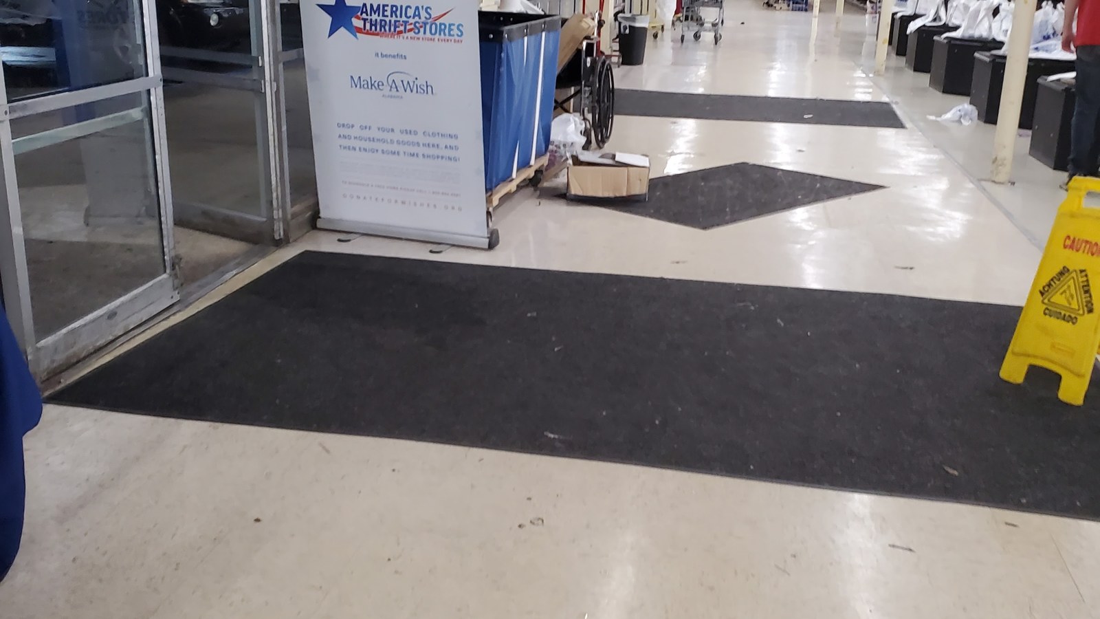 Store entrance beside a Make-A-Wish Alabama sign