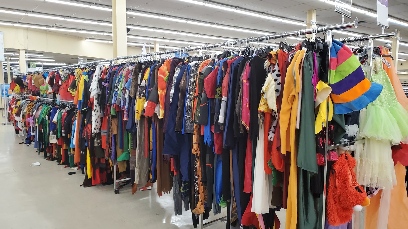 Bright costumes and playful outfits on a rolling rack