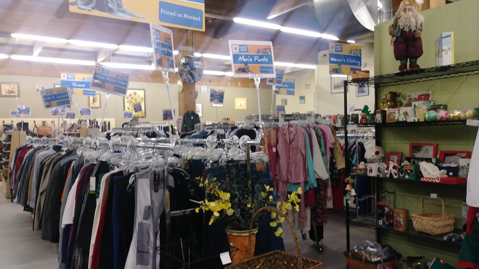 Clothing racks and home decor displays inside the store