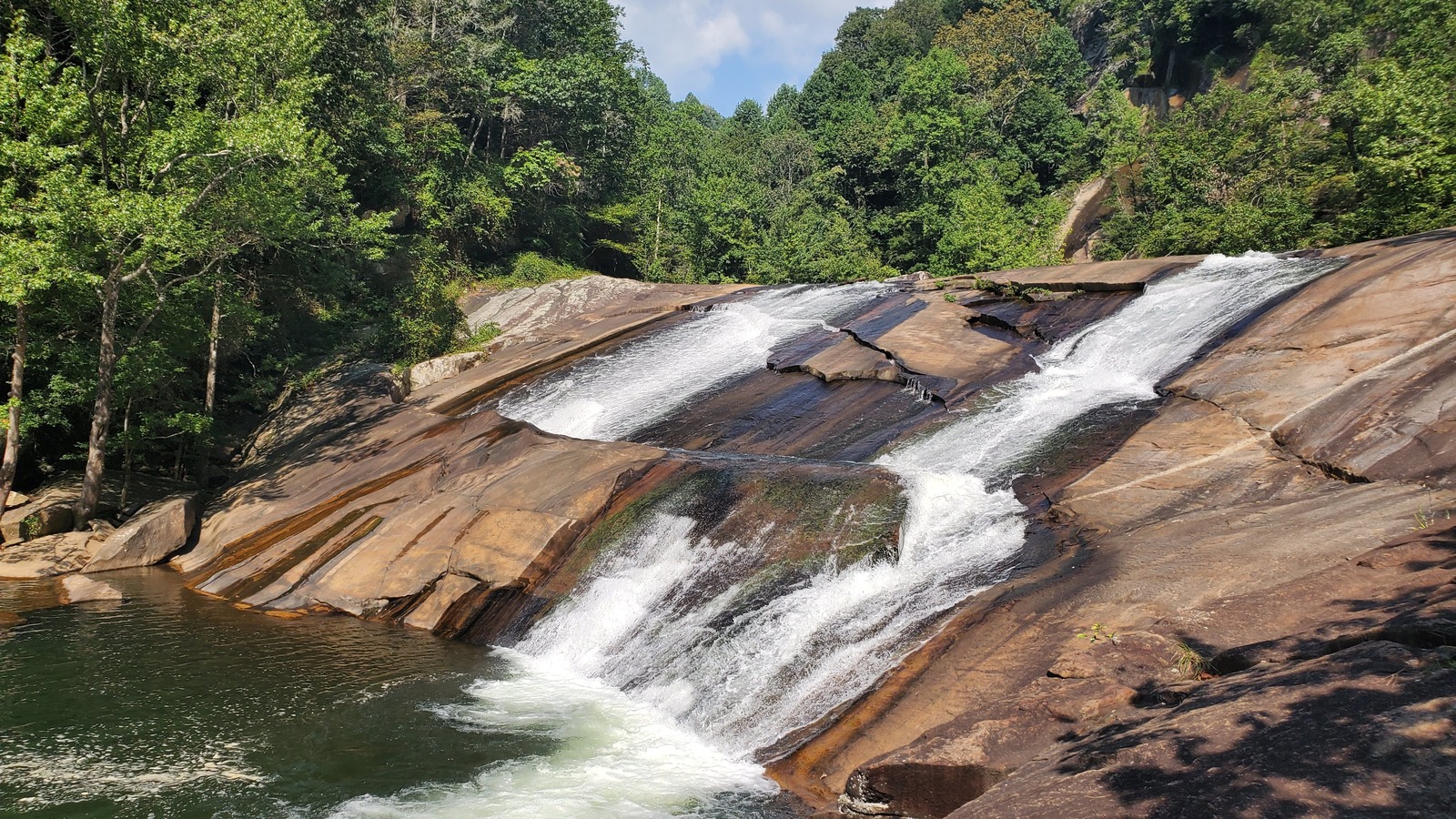 Broad granite slide and rushing water near the gorge floor at Tallulah Gorge State Park.