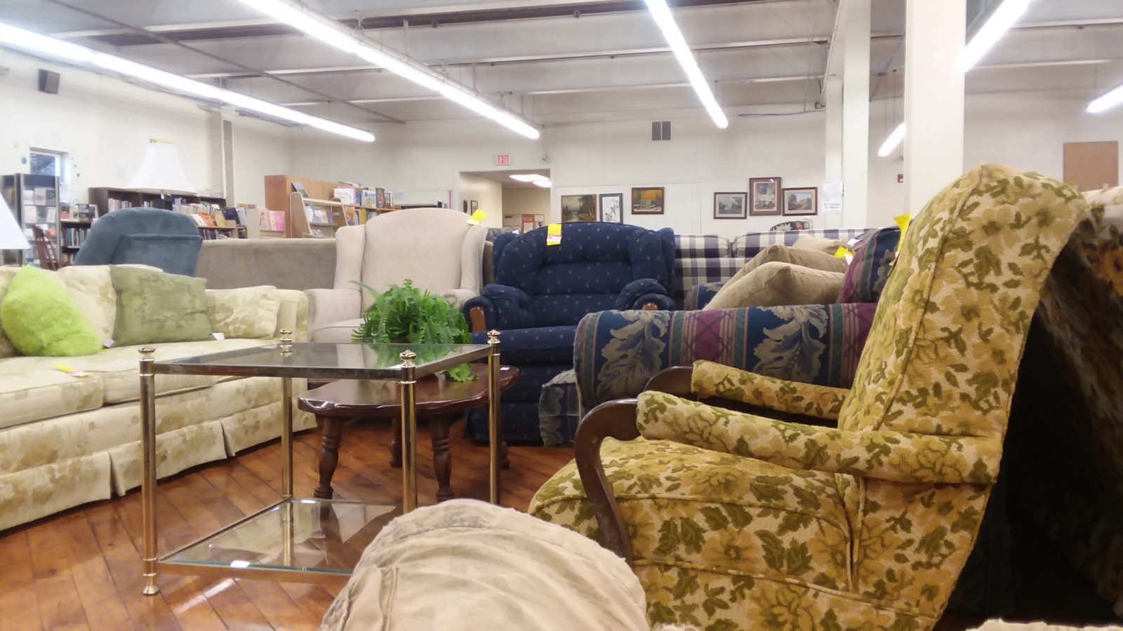 Sofas and upholstered armchairs arranged across the furniture department