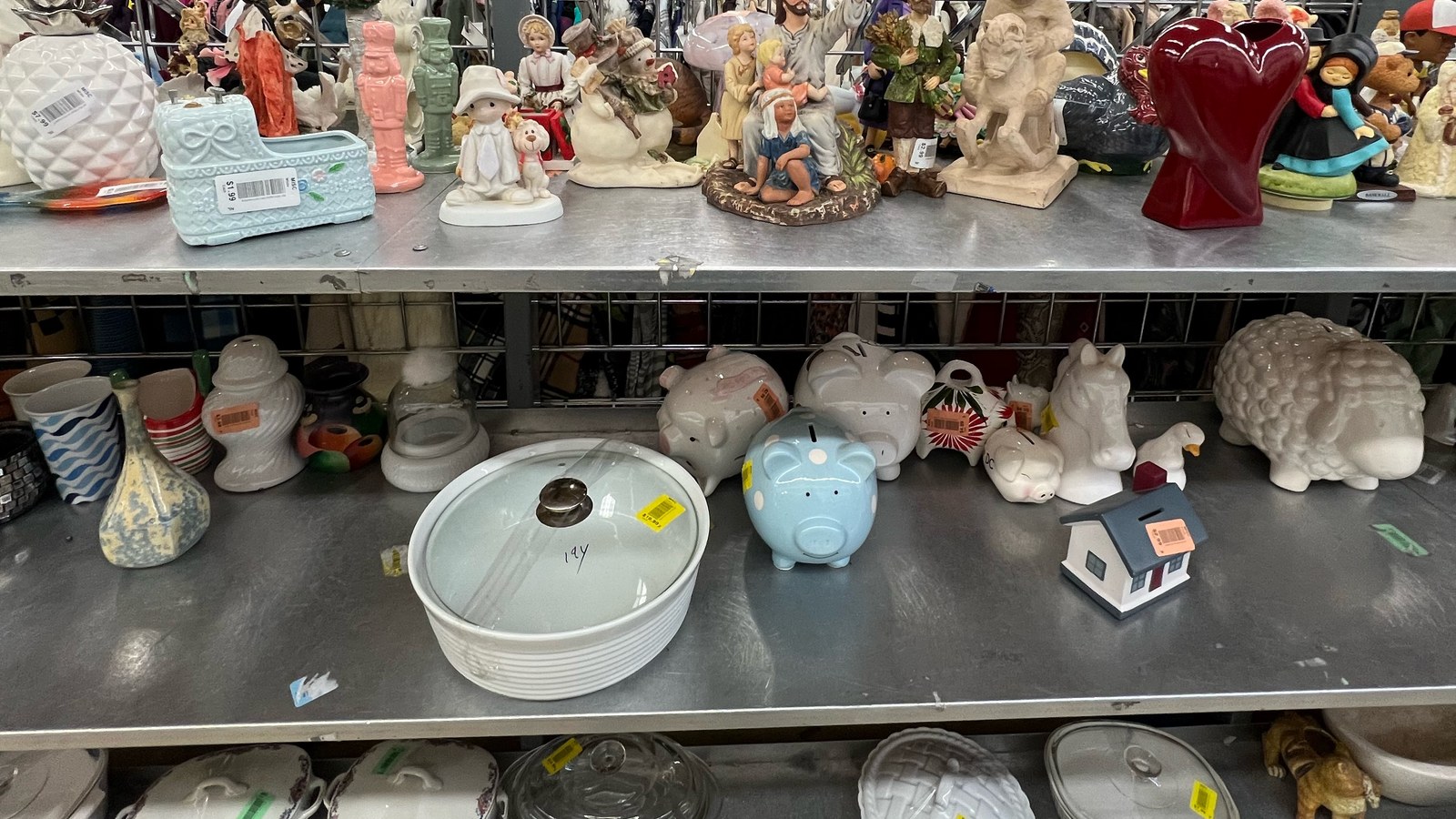 Figurines, decorative pieces, and small collectibles on a display shelf