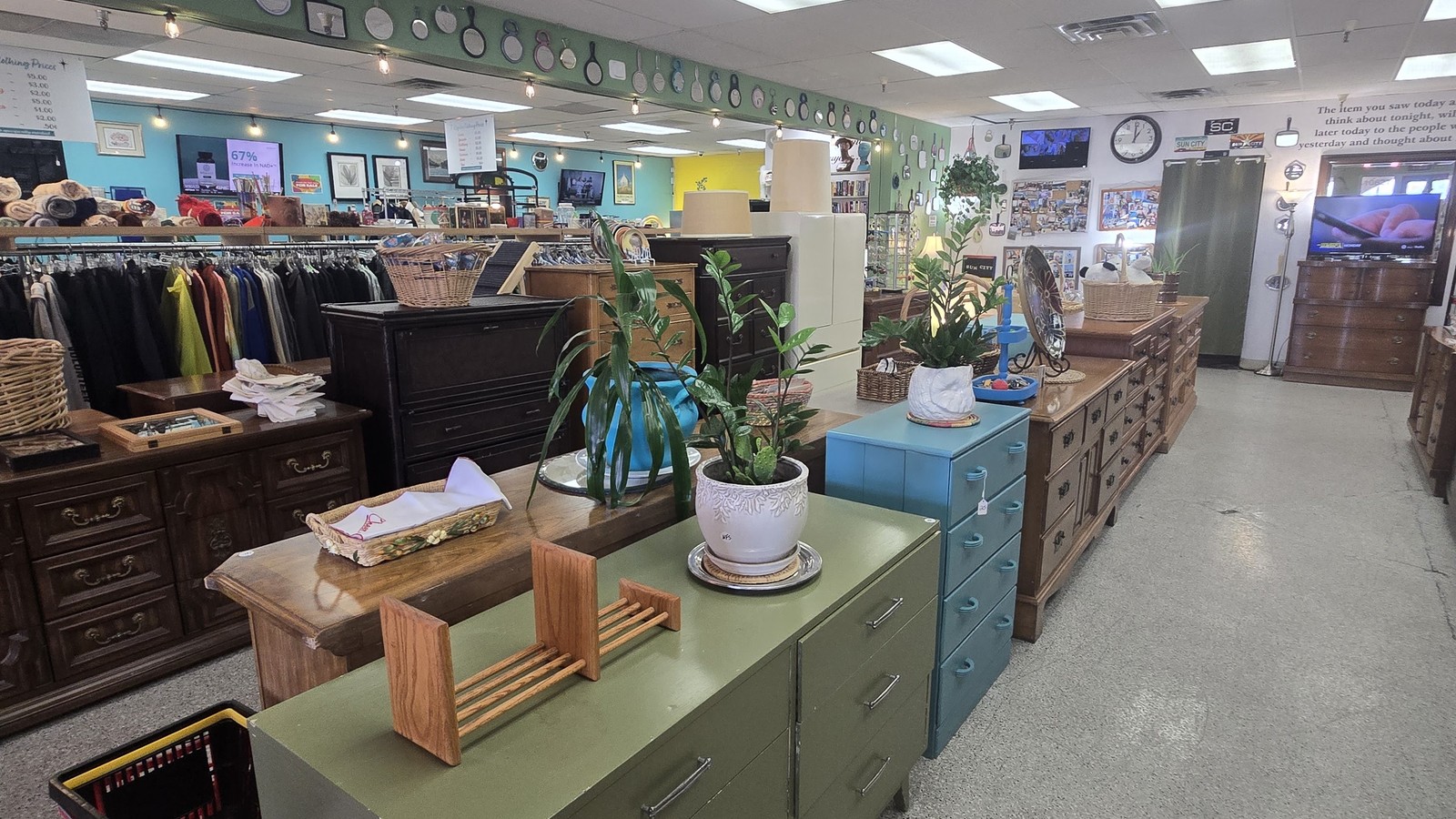 Furniture and home decor displays inside Sun City Thrift Shop