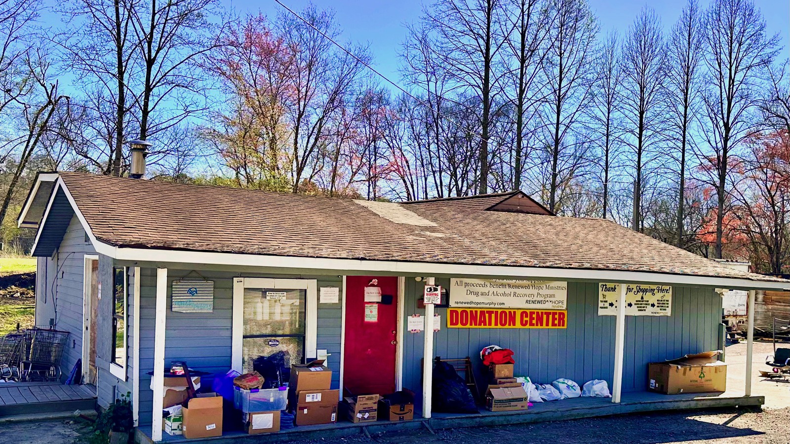 Blue and red donation-center storefront at Renewed Hope Ministries in Murphy