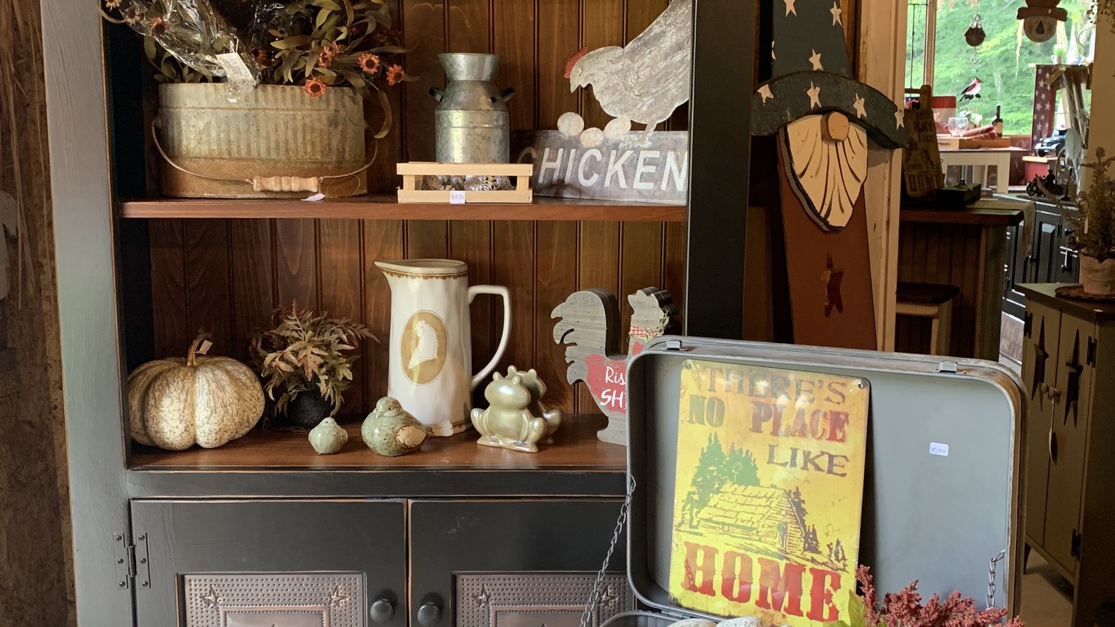 Pottery, farmhouse accents, and rustic signs displayed at New Old Stuff in Murphy