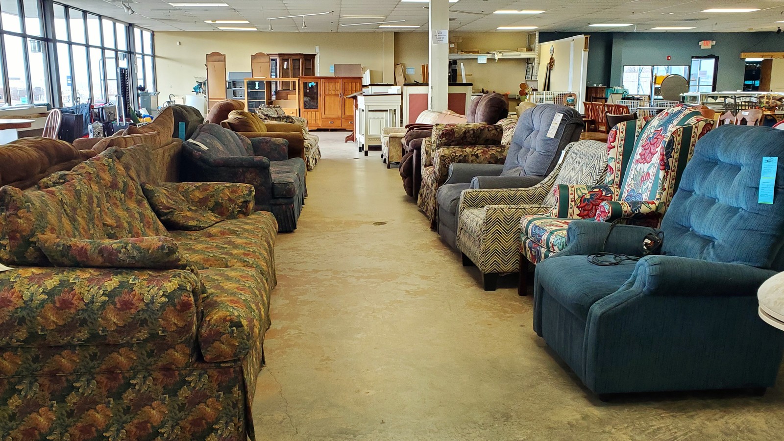 Sofas, recliners, and cabinets lined up at the Habitat ReStore in Maryville