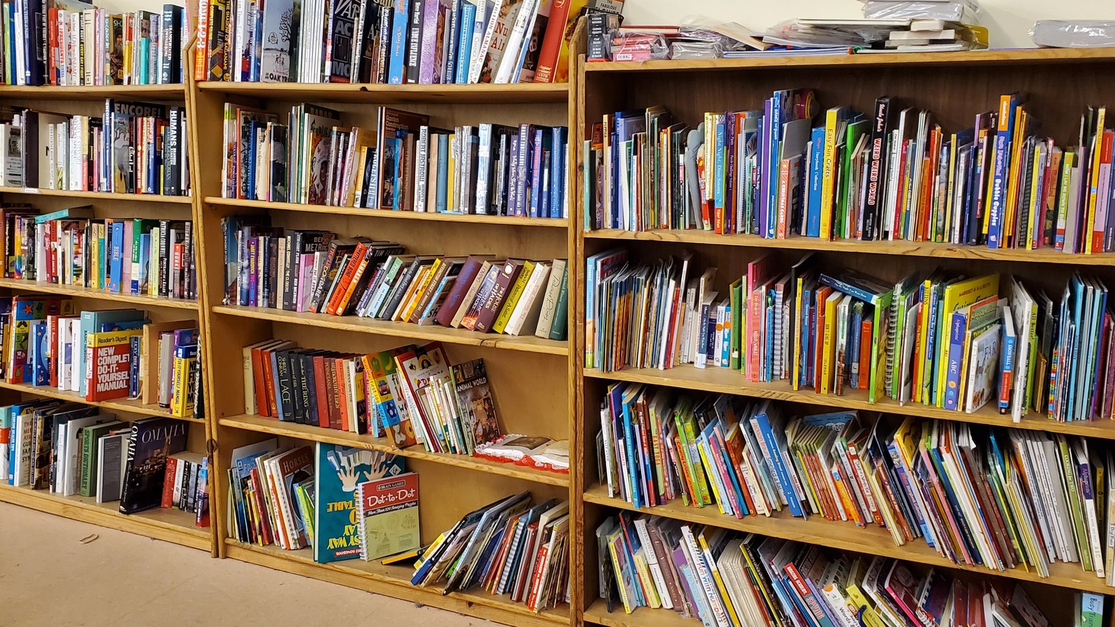 Shelves filled with adult and children's books at KARM Stores in Maryville
