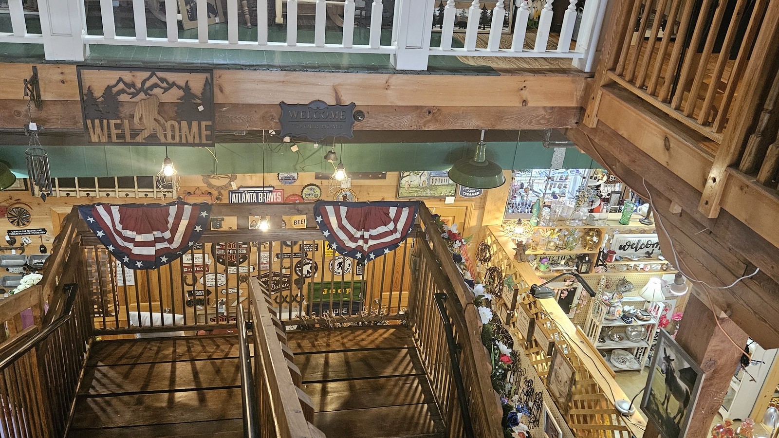 Wood staircase overlooking antiques and local crafts inside Homespun in Maryville