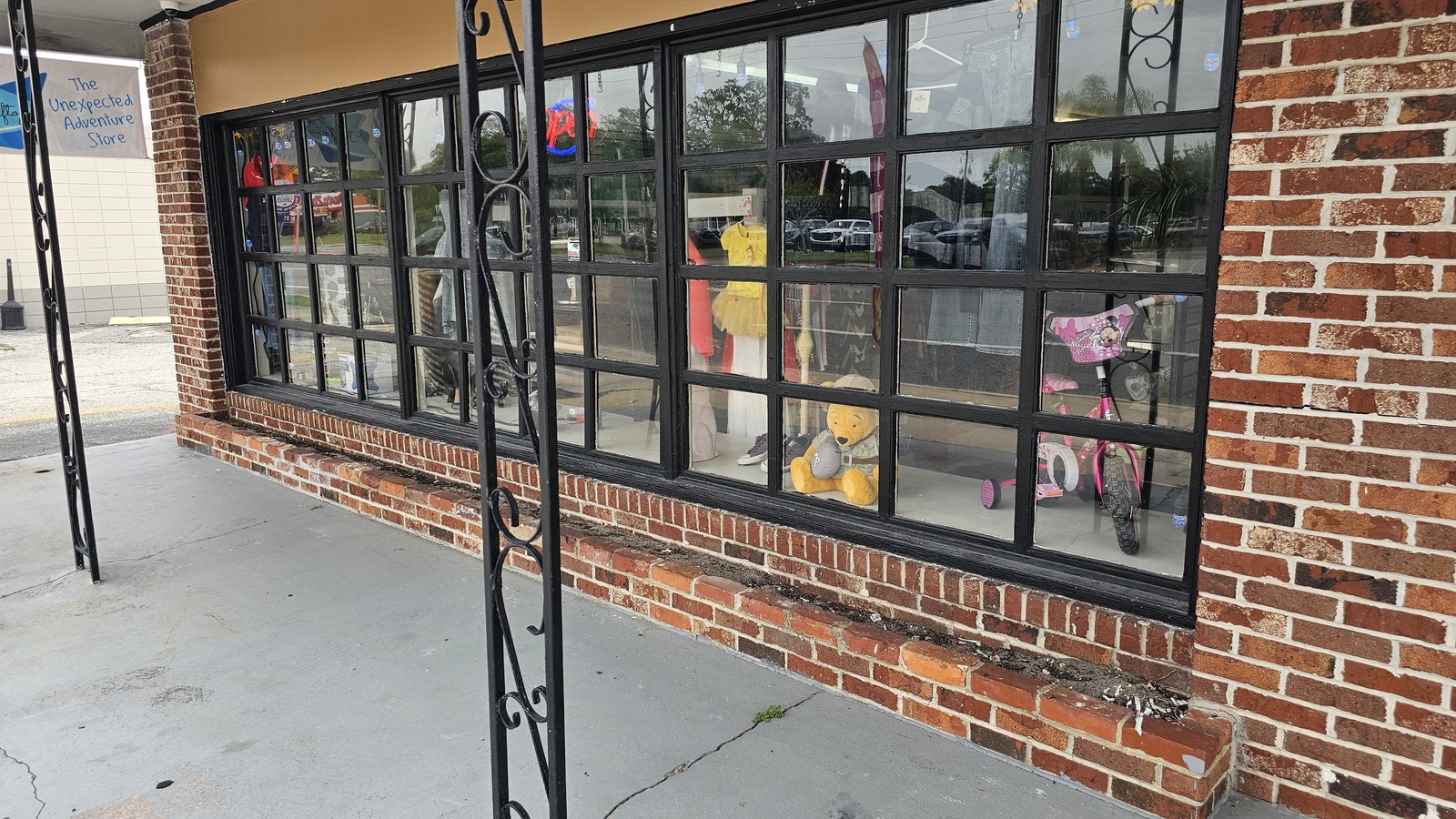 Brick storefront and display windows at Thriftopia in Titusville