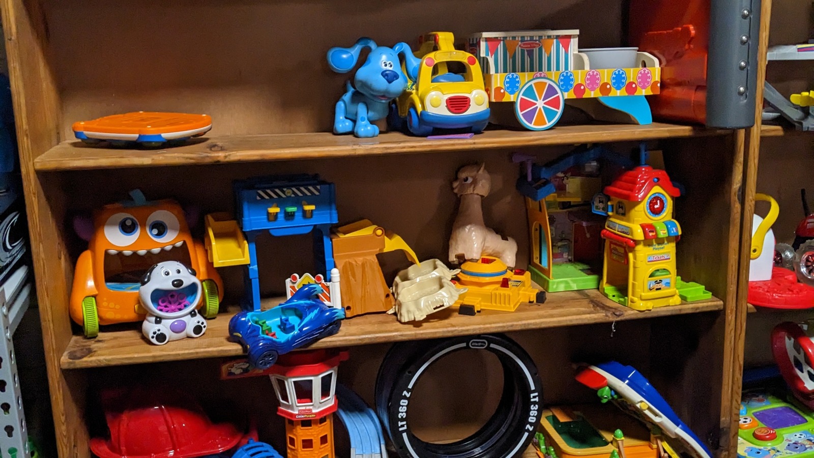 Colorful toys and children's finds arranged on wooden shelves at The Mystery Box Warehouse in Gastonia