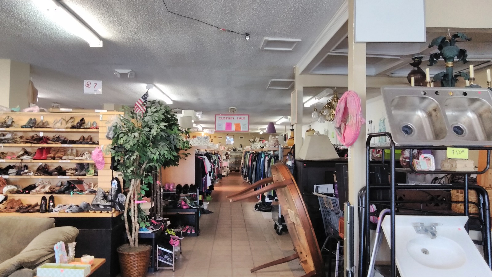 Clothing, shoes, furniture, and household pieces inside Thrift Mart in Gulfport
