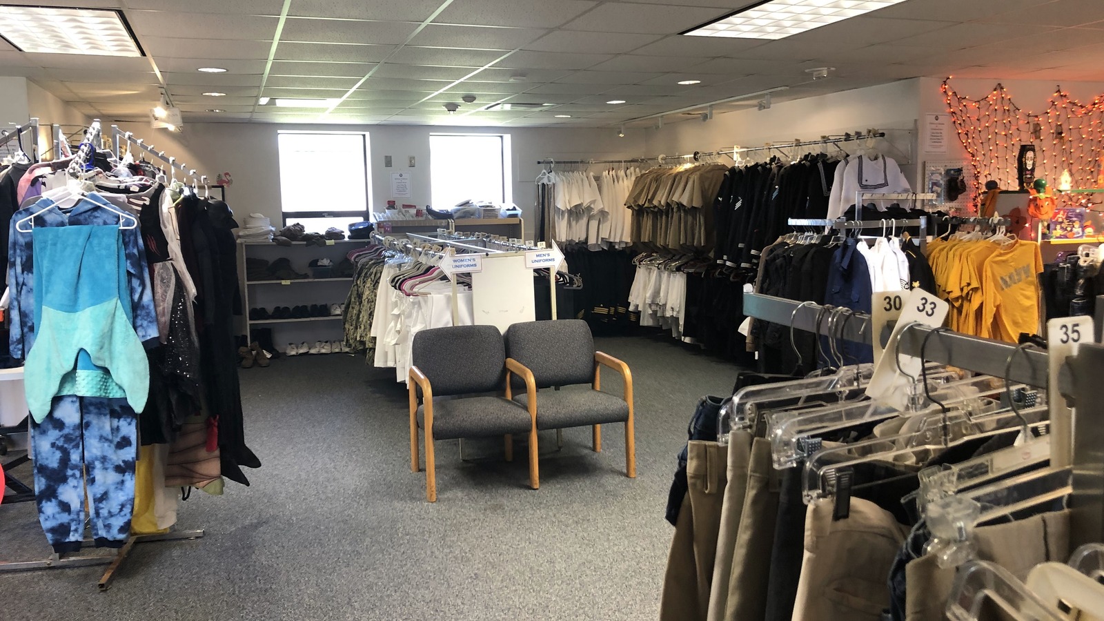 Clothing racks and furniture inside the Navy Marine Corps Relief Society Thrift Shop in Gulfport