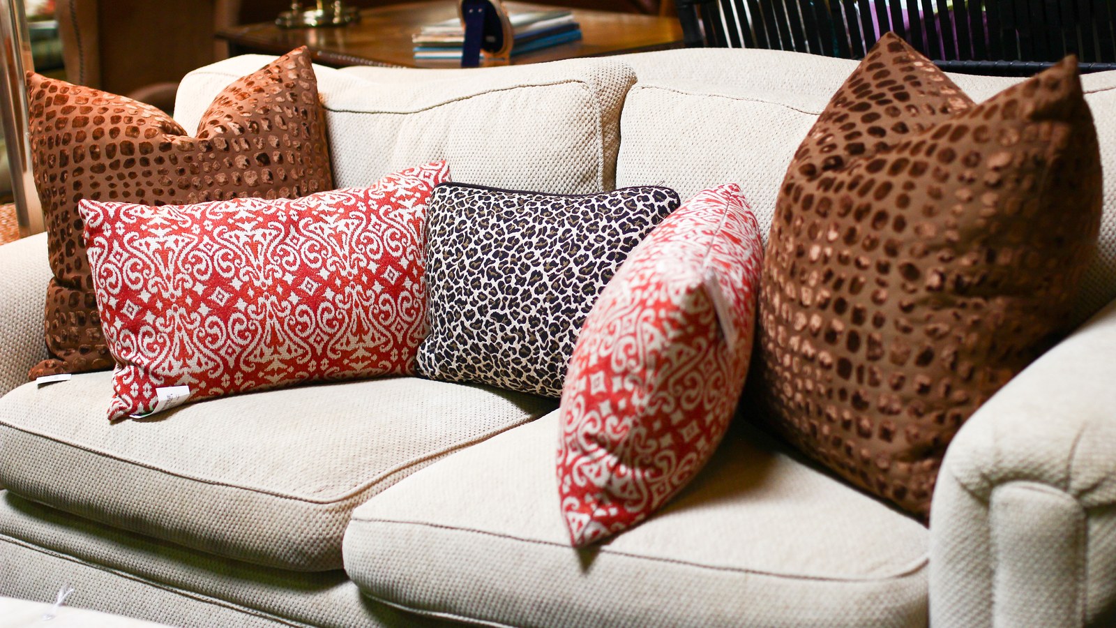 Designer sofa and patterned pillows in the Avery Lane showroom