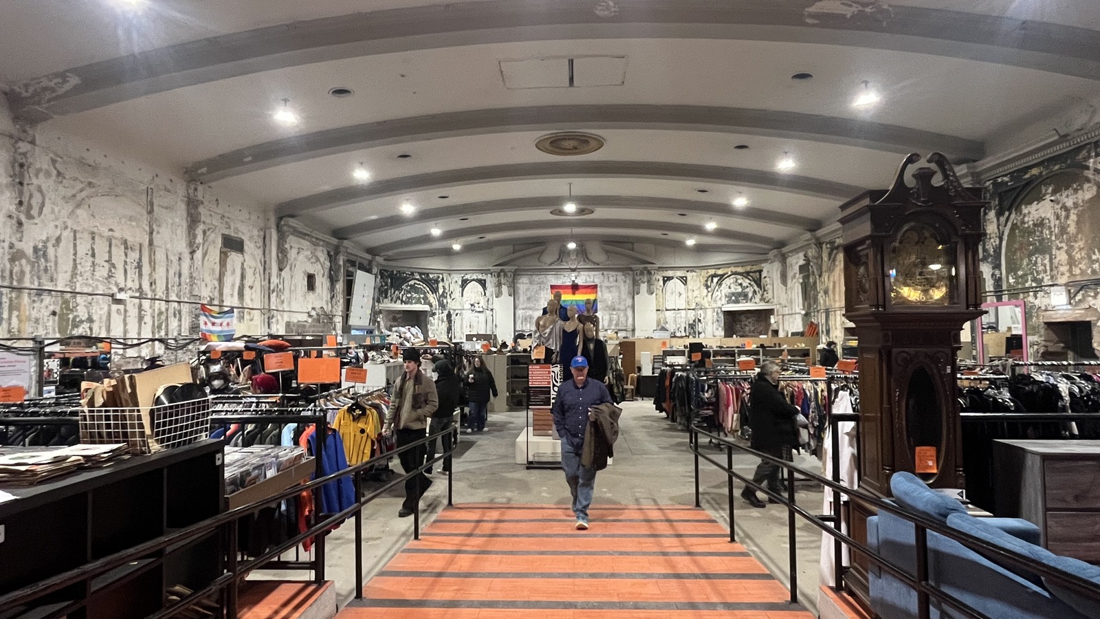 Orange center aisle between clothing racks at Brown Elephant Andersonville