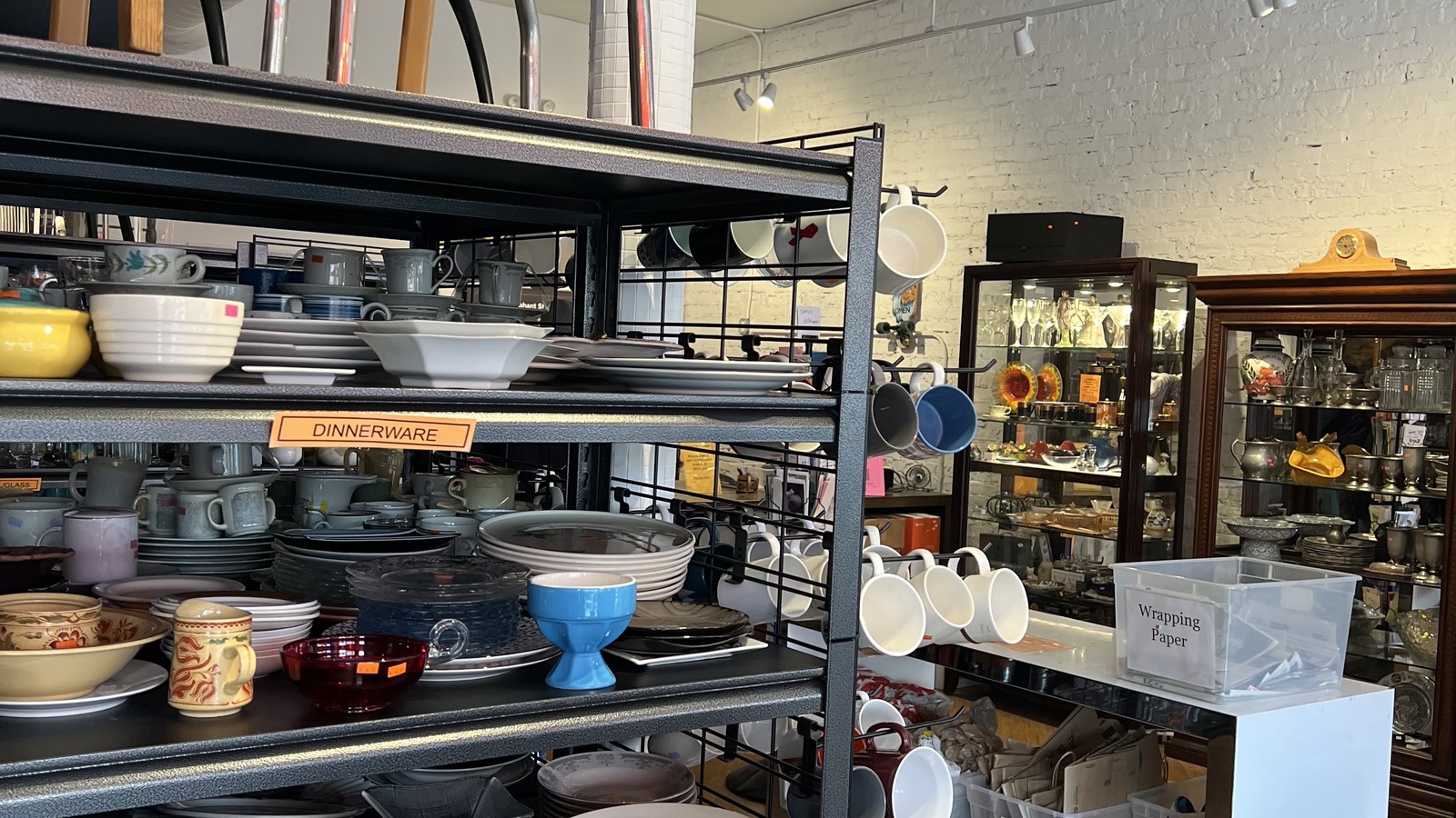 Dishware and serving pieces arranged by color at Brown Elephant
