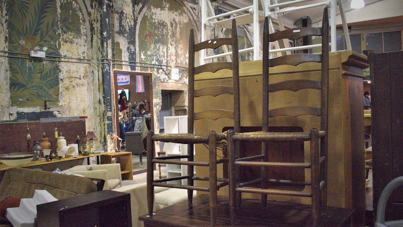 Wood furniture and shelving pieces on the Brown Elephant sales floor