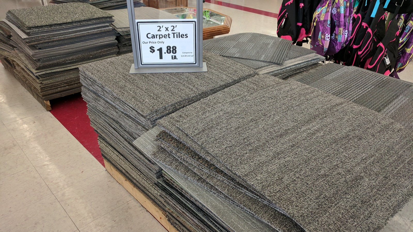 Folded area rugs stacked in the home department
