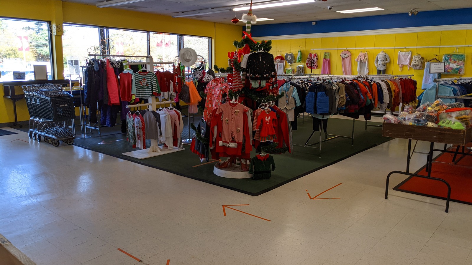 Clothing racks and sporting goods across the spacious sales floor
