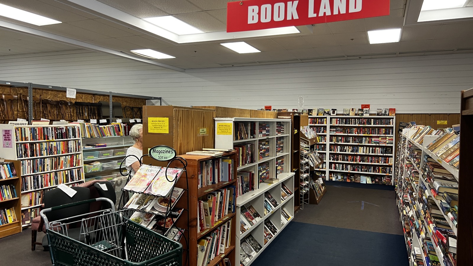Wide Bookland aisle with shelves of books on both sides