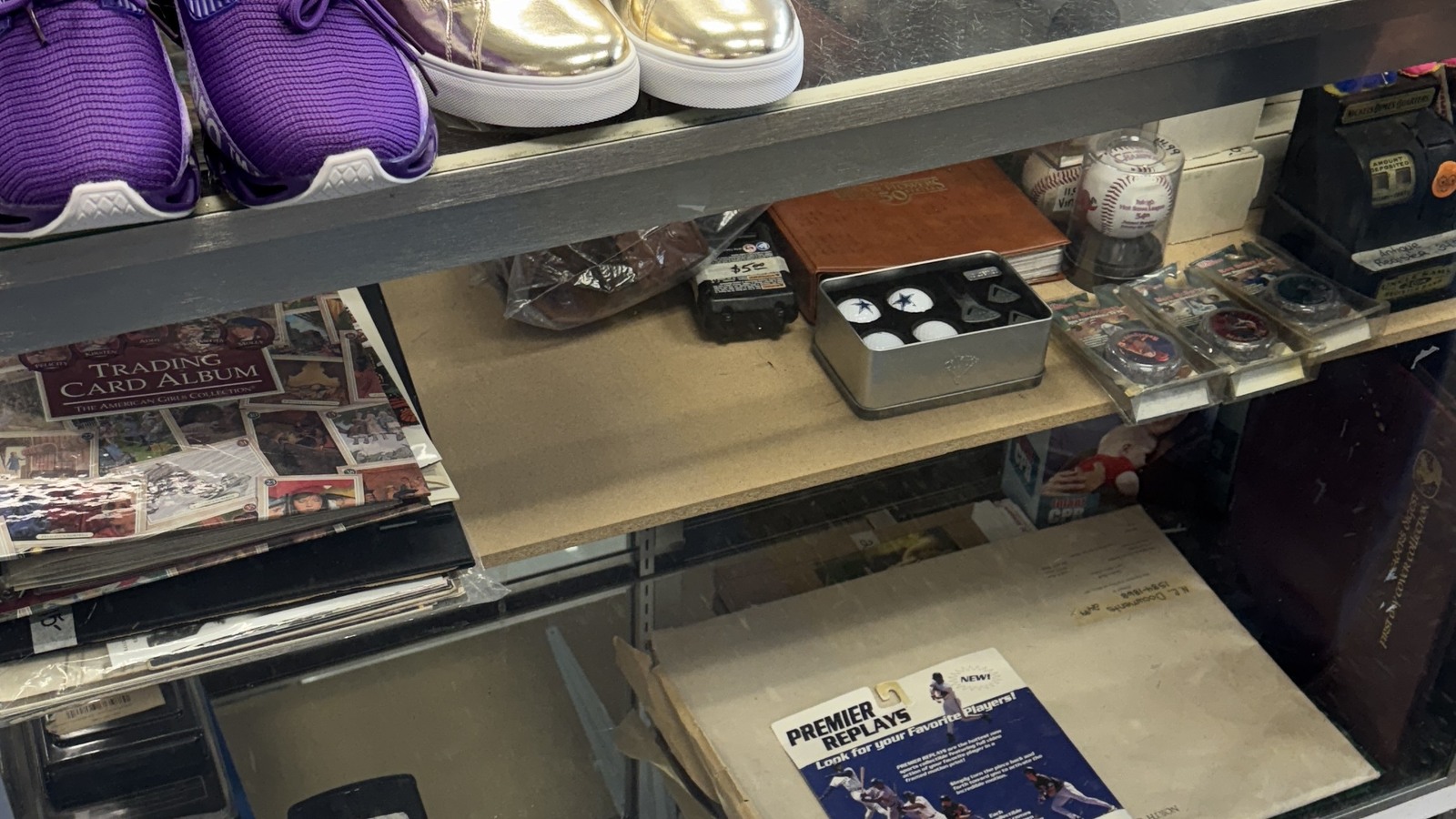 Electronics and small media equipment arranged inside a display case