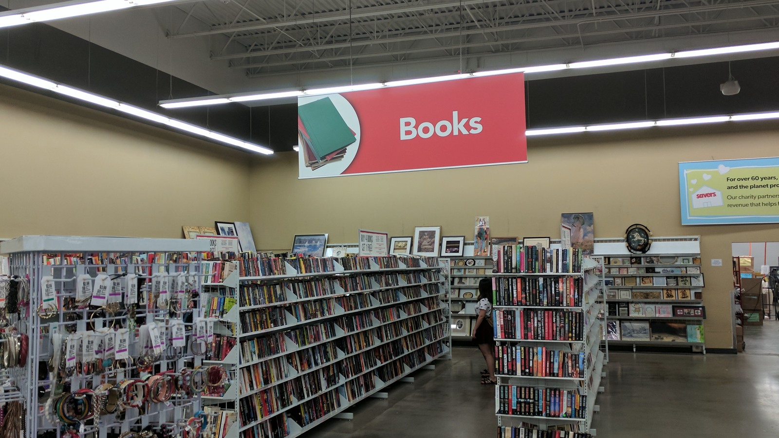 Wide Savers sales floor with clothing racks and media shelves