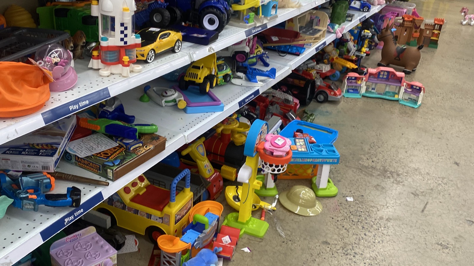 Bright children's toys organized on low shelves