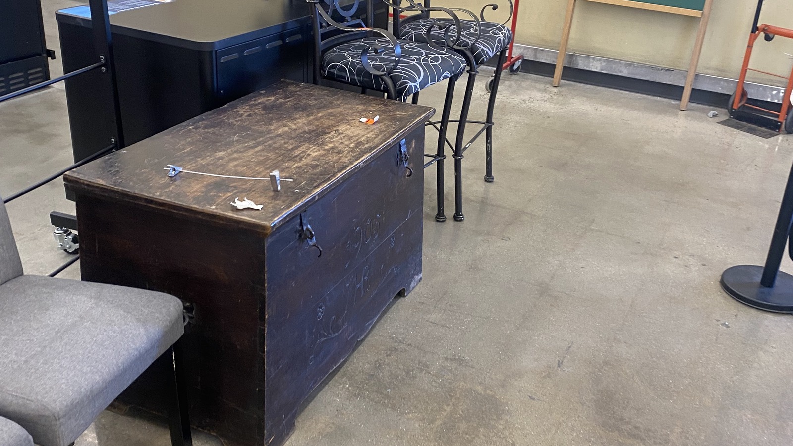 Desks chairs and small furniture on the Savers sales floor