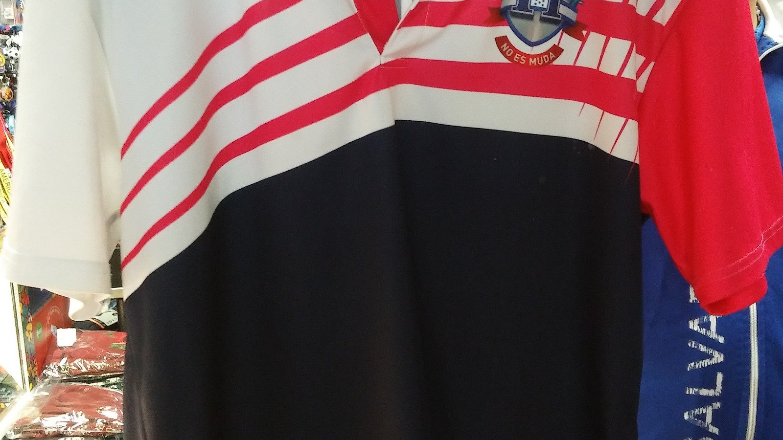 Red white and black striped polo shirt on display