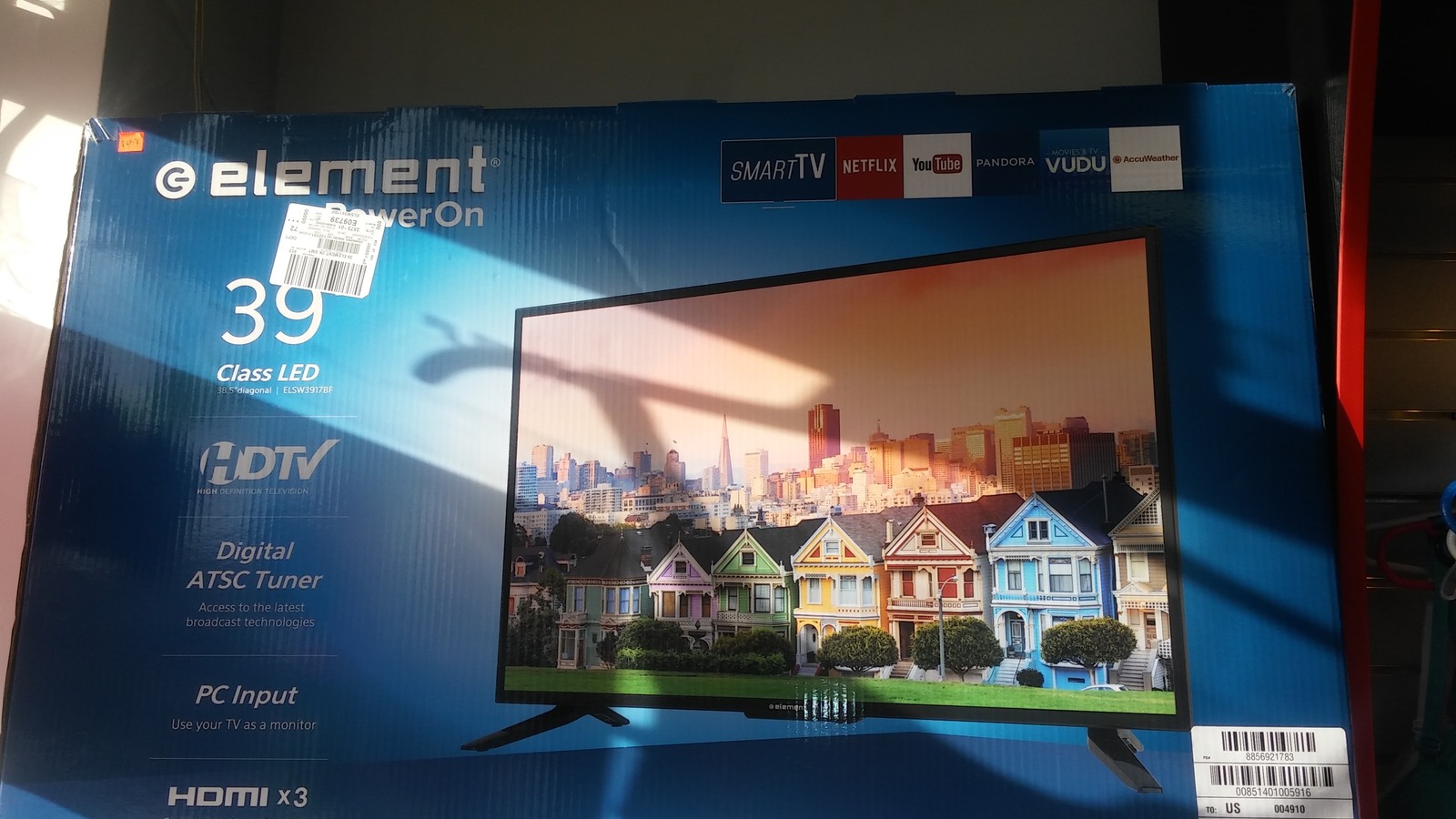 Boxed flat-screen television available inside the shop