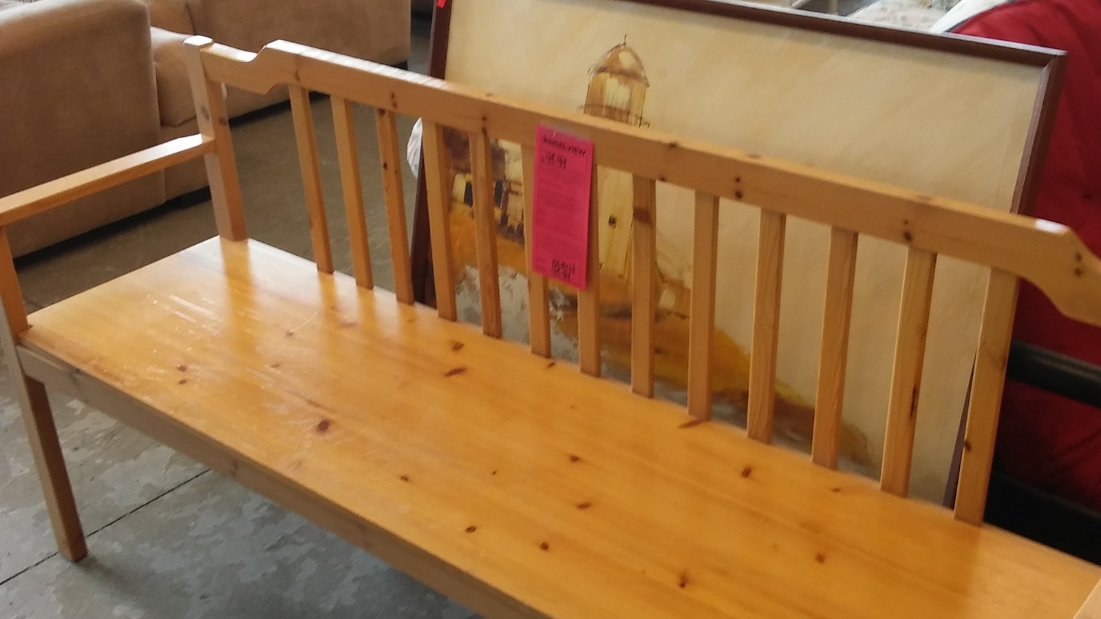 Solid wooden bench with a high paneled back