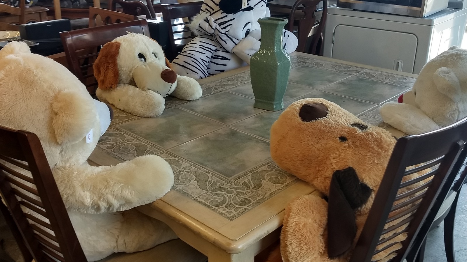 Stuffed animals gathered around a small table