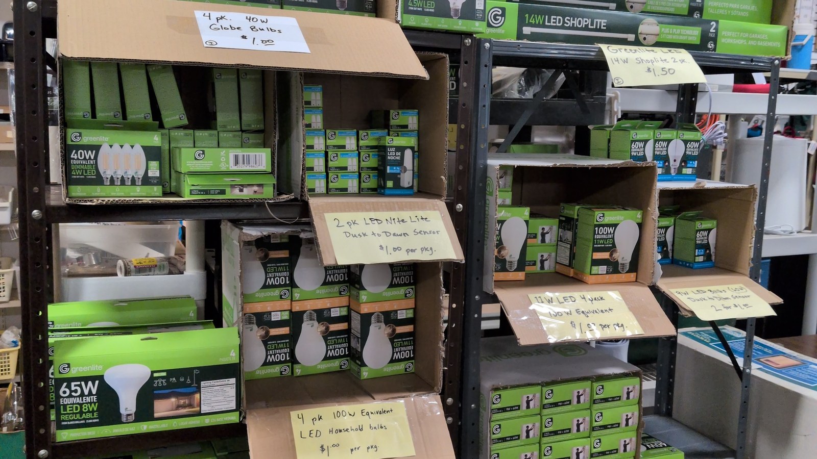 Shelves of boxed LED light bulbs at VINE Home Thrift Store