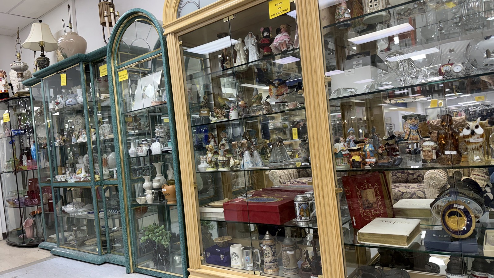 Glass display cabinets filled with small collectibles
