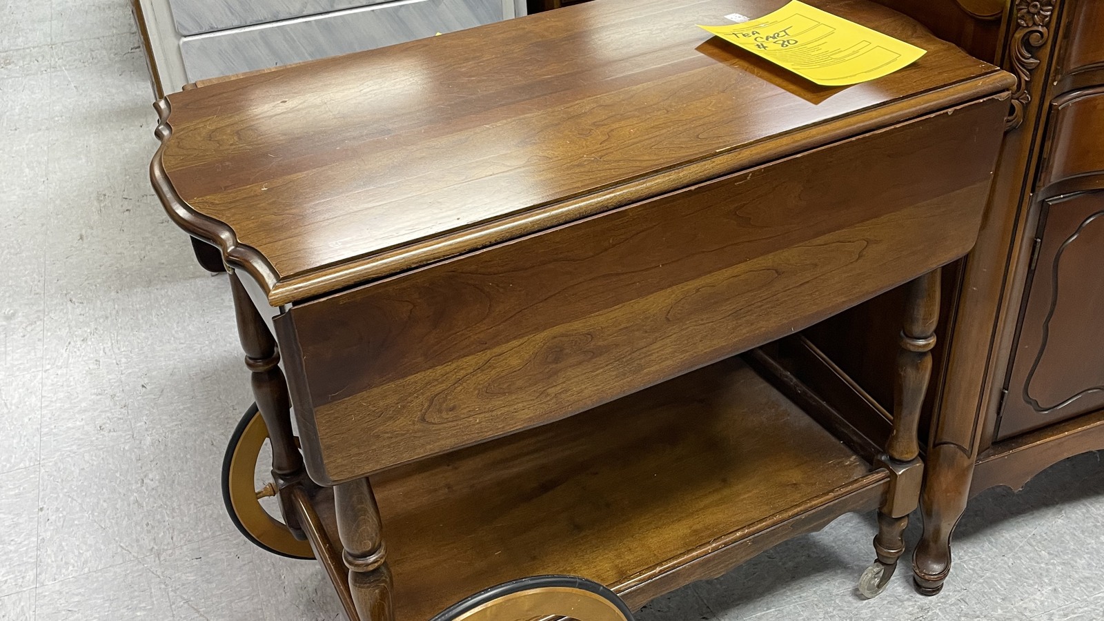 Warm wood piano with carved legs on the furniture floor