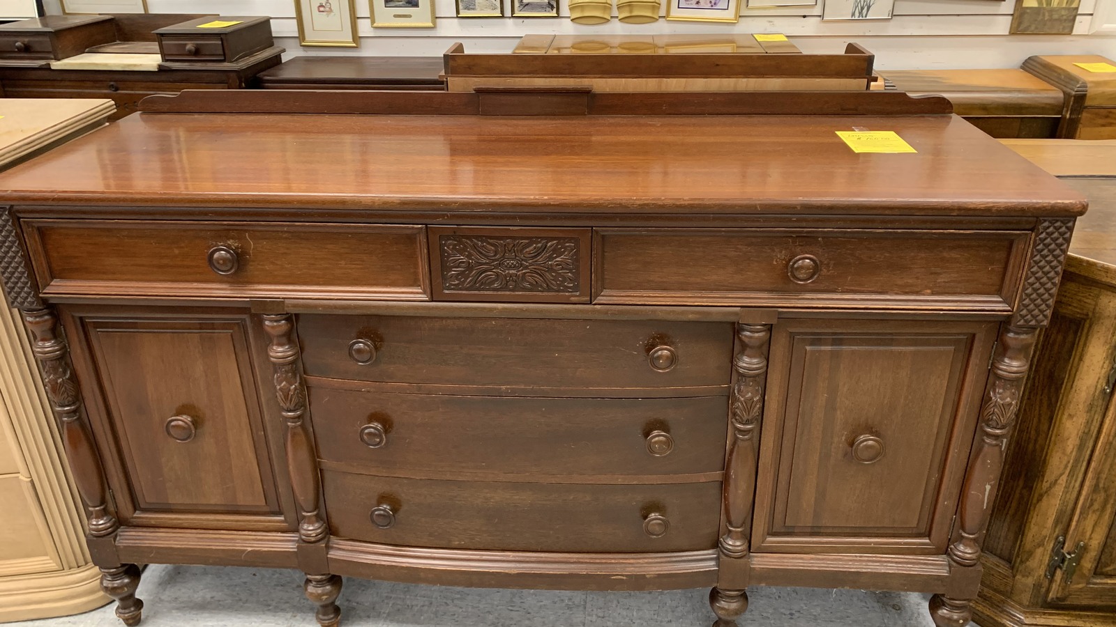 Large vintage wood sideboard with carved drawers and cabinets