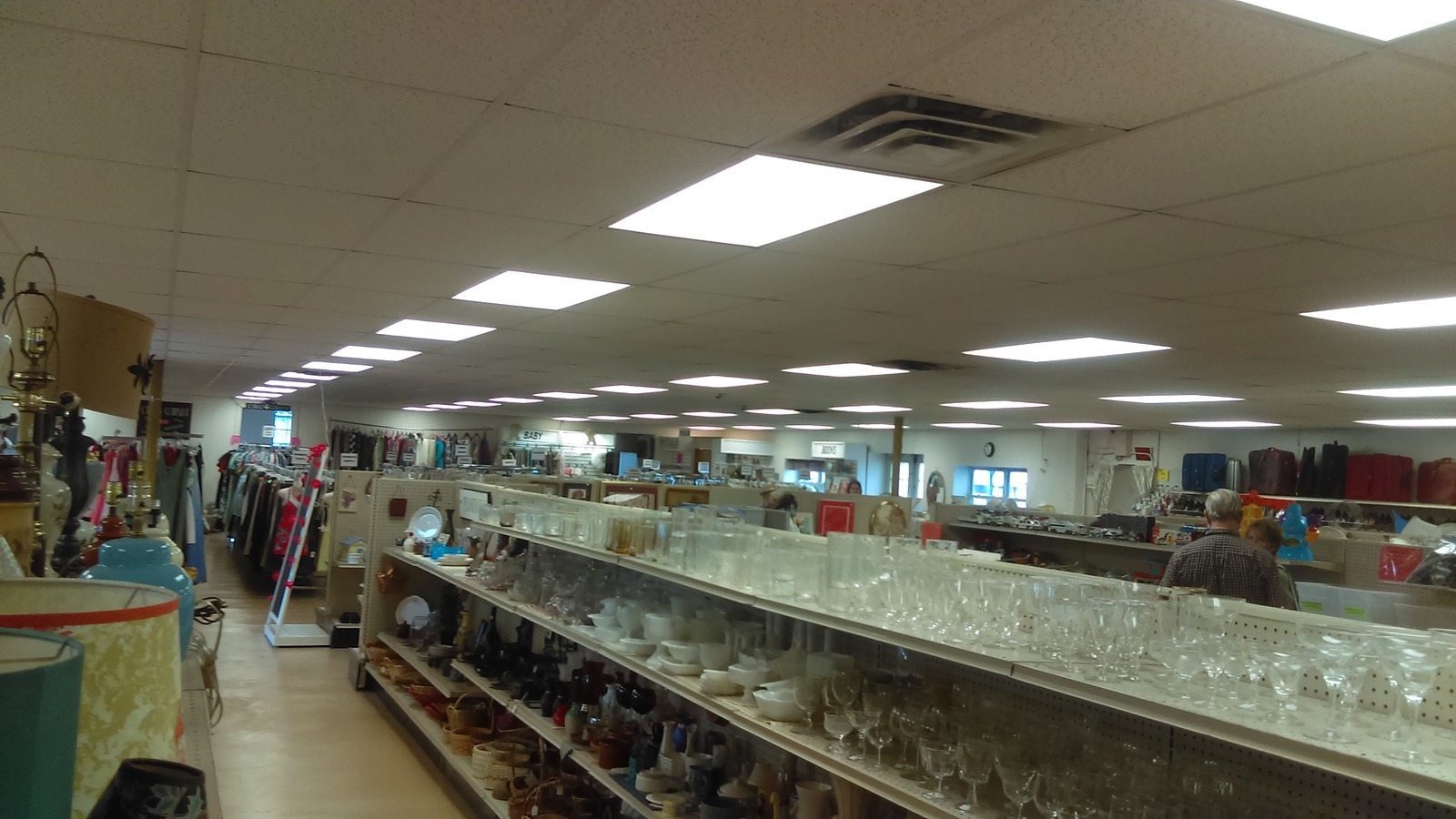 Long organized glassware aisle inside Country Closet in Turbotville