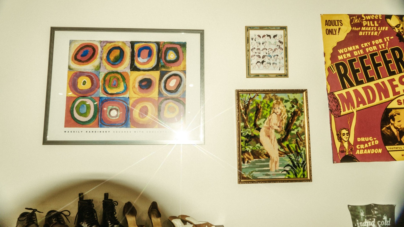 Vintage framed art and shoes displayed at Wishbone Vintage in New Smyrna Beach