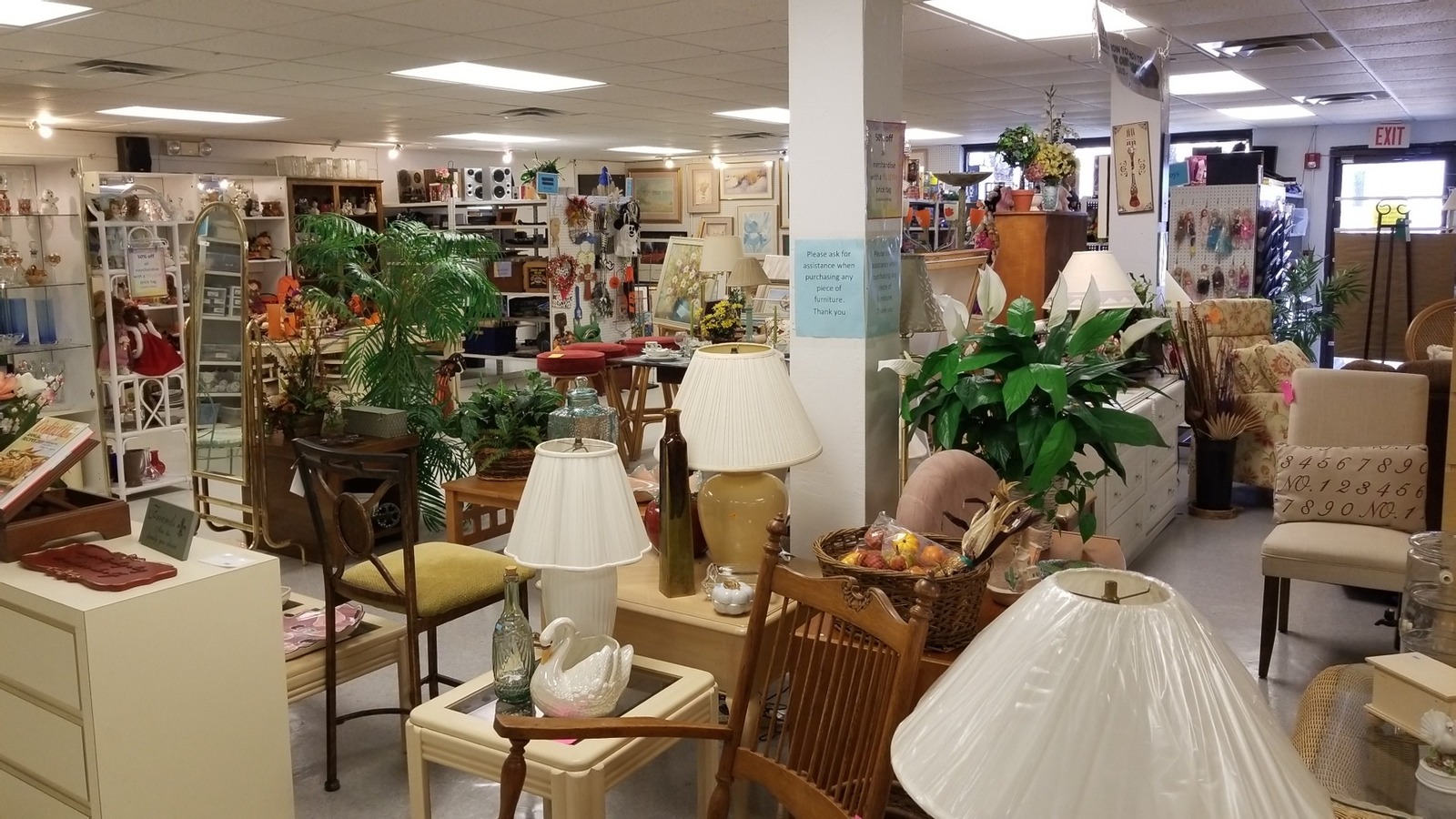 Furniture, lamps, art, and home decor inside the New Smyrna Beach Habitat ReStore