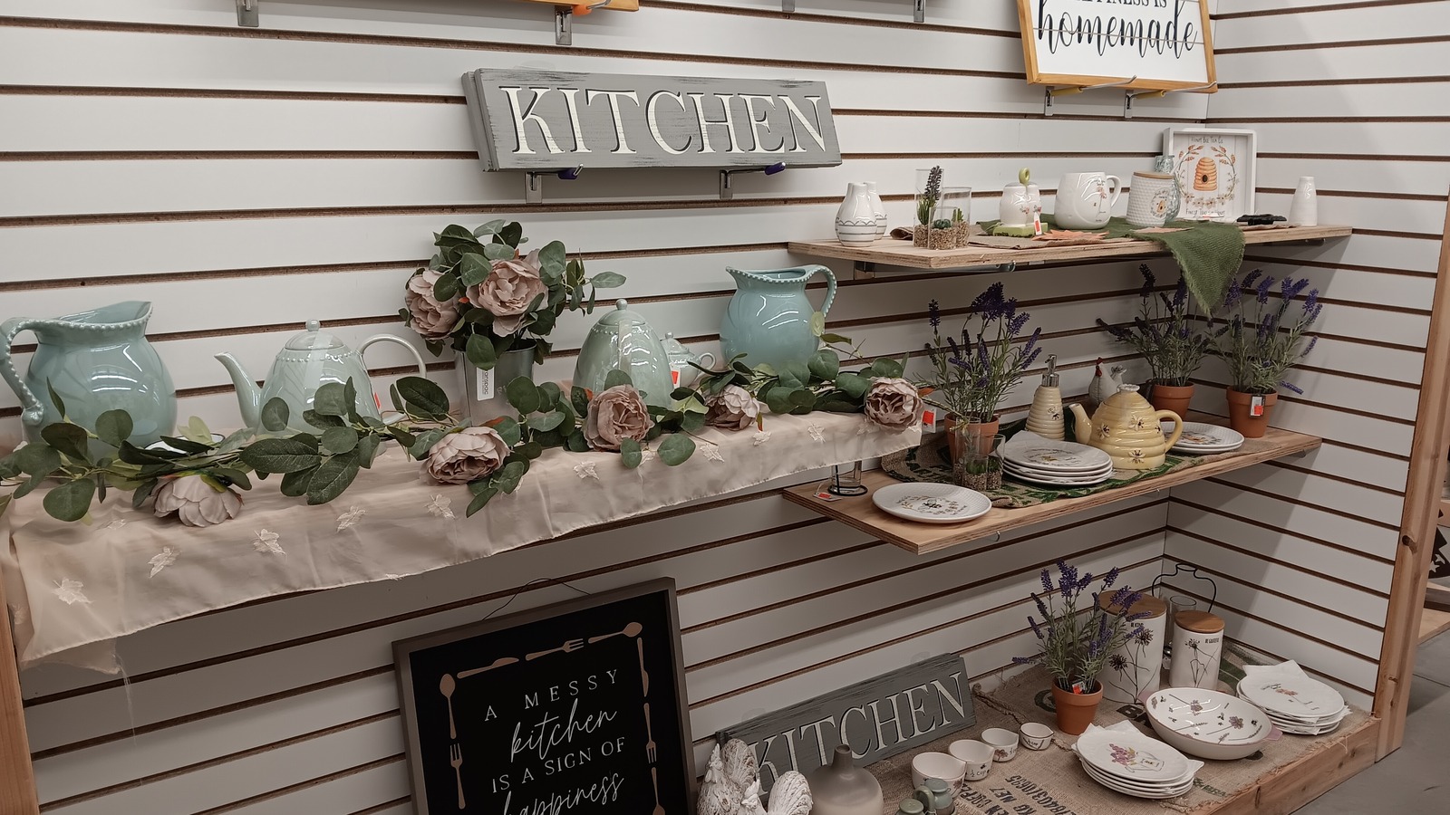 Kitchen-themed dishes and home accents at The Mercantile Outlet in Troy