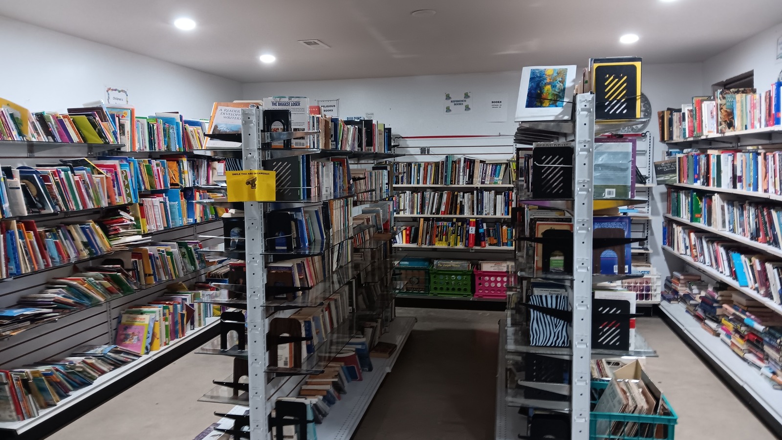Long book aisles inside Budget Boutique in Troy, Missouri