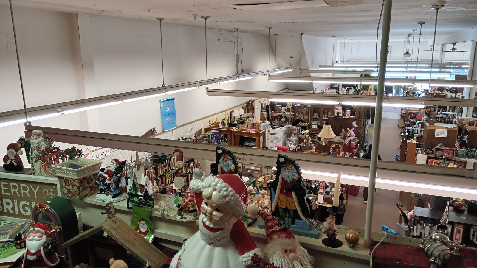 View across the multi-level vendor displays inside Mac's Attic Flea Market in Alliance
