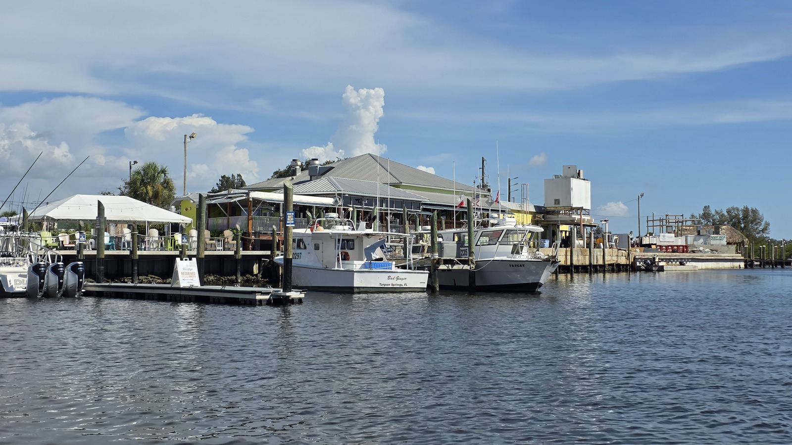 Boats and dockside dining along the working waterfront beside Rusty Bellies in Tarpon Springs